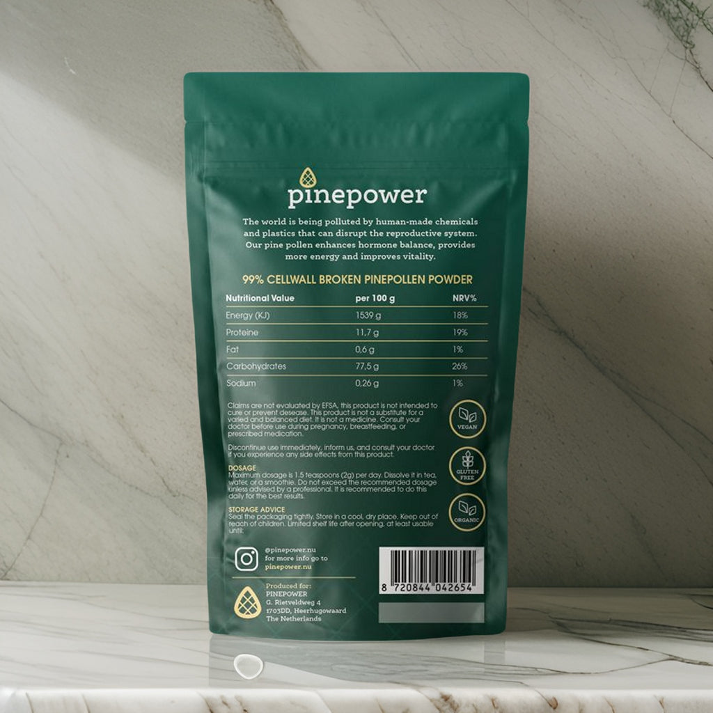 The back of the dark green PinePower Pine Pollen package highlights key benefits such as hormonal balance and energy support. It includes a nutritional table showing proteins, fats, and carbohydrates per 100 grams, with 99% broken cell walls for maximum absorption. Additional details emphasize sustainability and usage instructions, alongside vegan, gluten-free, and organic certifications.